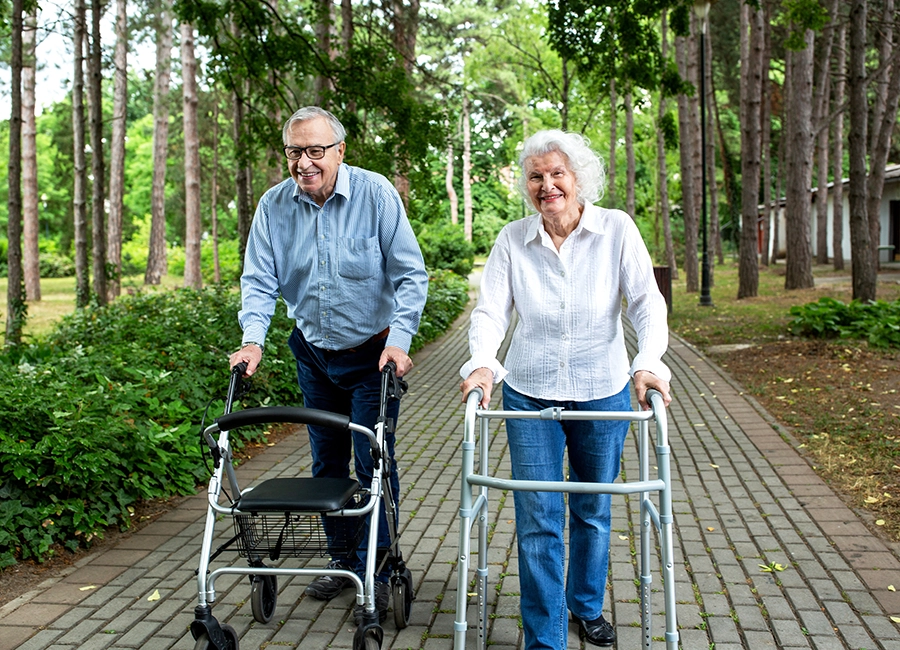 man with elderly man with a walker
